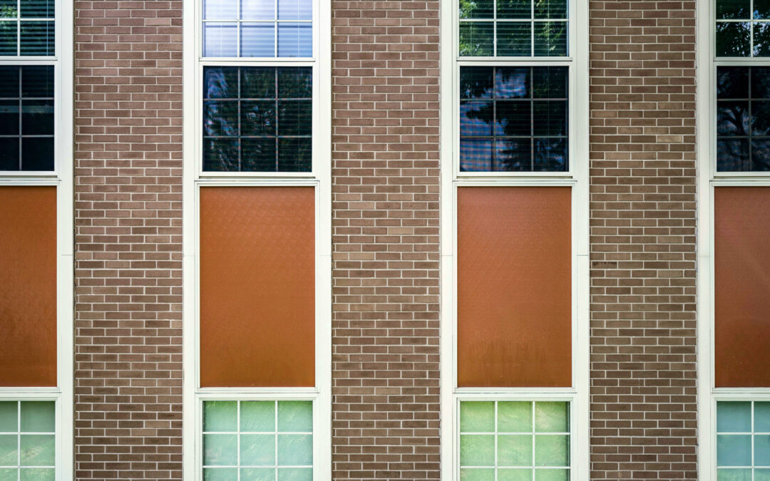 Close up of school building exterior made of brick with windows